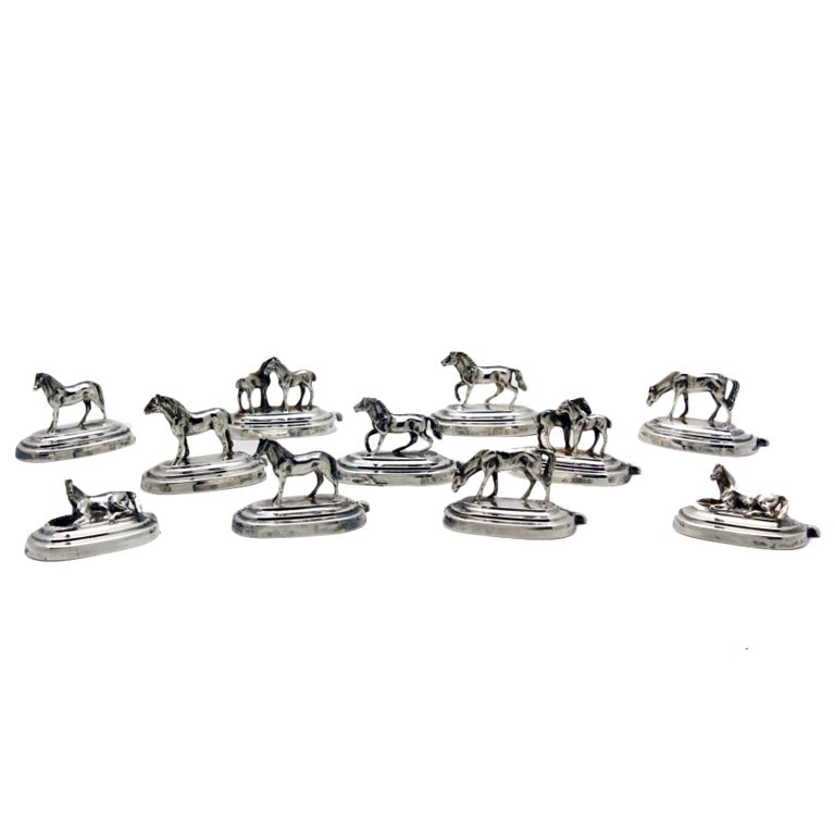 Eleven silver horse place-card holders, 1920s
